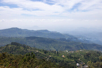 Fototapeta na wymiar Views across the tea plantations in the Nuwara Eliya District, Central Province of Sri Lanka