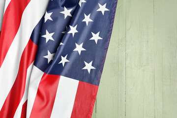 Fototapeta na wymiar USA flag on green wooden background. Memorial Day celebration