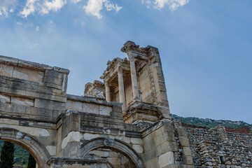 Ancient arch ruins made of stone masonry standing against a clear blue sky in Ephesus, in Ephesus,...