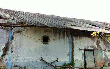 Selective focus. Old industrial building. Damaged industrial building  empty damage warehouse.
