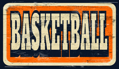 Aged and worn vintage basketball sign on wood