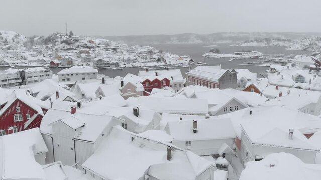 Kragero, Telemark County, Norway - A Snowy Townscape During the Winter Season - Aerial Pullback Shot