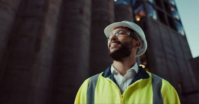Engineer, man and thinking outdoor in city at night with a solution, business planning with helmet or problem solving. Person, architecture or worker with project idea, construction decision or smile