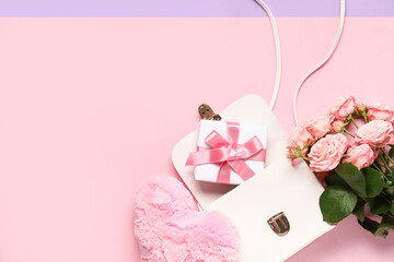 Purse with fit box, heart and bouquet of roses on pink background. Valentine's Day celebration