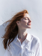 Fototapeta premium Young redhead woman portrait with copyspace