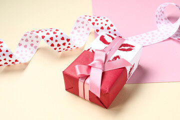 Beautiful gift box and ribbon on color background. Valentines Day celebration