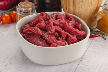 Raw beef meat - sliced strips