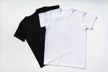 Cotton T-shirt on gray background flat lay top view