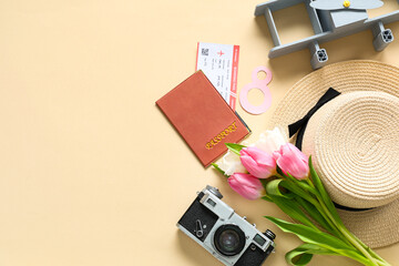 Composition with stylish hat, passport, ticket and tulip flowers on color background. International...