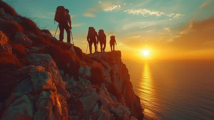 Gardinen Hikers team climbing up mountain cliff at sunset © Anna
