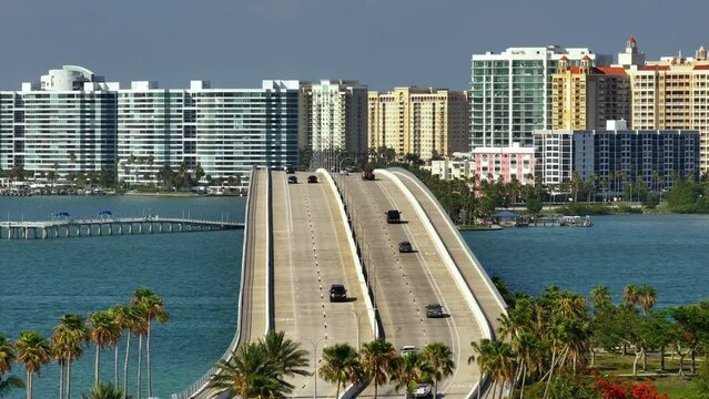 Sarasota Florida with waterfront office buildings and John Ringling Causeway from downtown to St. Armands Key. Development of housing and transportation in the US.