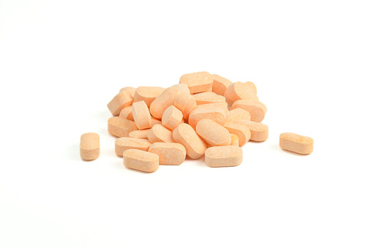 An image isolated close-up heap pill vitamin c medicine product drug medical for nourishing the body for health.
