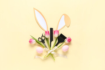 Hairdressing accessories with Easter eggs, bunny ears and flowers on beige background