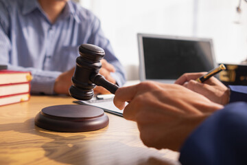 A judge gavel is prepared in the courtroom to be used to give a signal when the verdict is read after the trial is completed. Concept judge gavel is prepared to symbolize the decision in a court case.