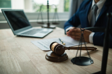 A judge gavel is prepared in the courtroom to be used to give a signal when the verdict is read after the trial is completed. Concept judge gavel is prepared to symbolize the decision in a court case.