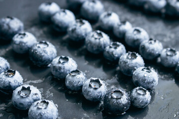 Wet blueberries on black background. Forest berries with water drops on the table. Blueberries isolated. Summer harvest. Vitamin and antioxidant concept. Juicy dessert. Fresh ripe berries. - 748518210