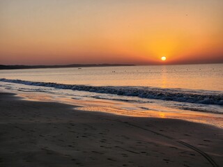 Fototapeta na wymiar Diu, Dadra and Nagar Haveli and Daman and Diu India - Feb 22 2024: Sunrise at Ghoghla beach - a blue flag beach of Diu.