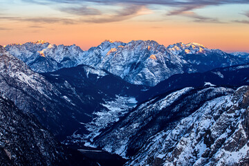 Mountain landscape with snow-capped peaks at beautiful sunset. Dolomites, Italy
