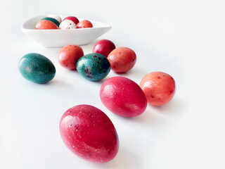 Easter eggs colorful scattered on white background. Easter, spring holiday. Isolated on white, copy space