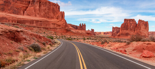 Scenic road in the red rock canyons. Arches National Park, Moab, Utah, United States. Adventure...