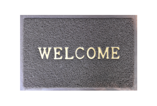 welcome message on grey curly rubber fiber door mat with purple frame isolated on transparent