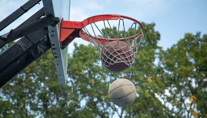 Ball in basketball hoop. Sport. Hobby. Lifestyle