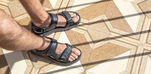 Fototapeta na wymiar Man wearing sandals. Summer. Fashion