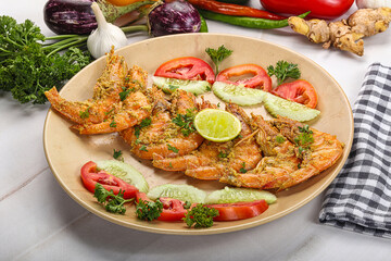 Grilled prawn served lime and vegetables
