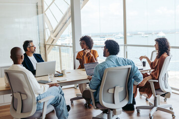 Business people collaborating and discussing ideas in a modern office