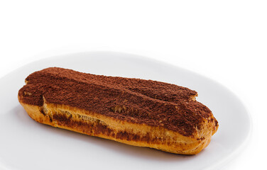 delicious chocolate French eclair on plate