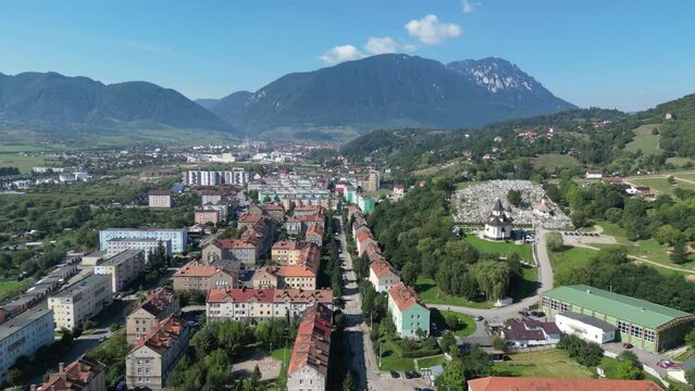 Aerial View of City in Romania with Transfagarasan Mountain Background