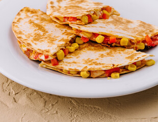 Mexican quesadilla with vegetables on plate