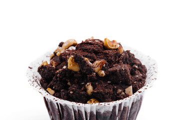 One black chocolate muffins with nuts crumbs isolated