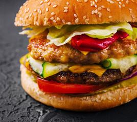 burger with two cutlets and fresh vegetables