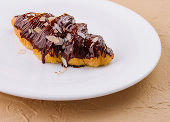 fresh baked croissant with chocolate and almonds