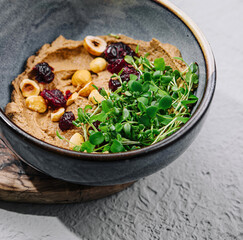 Bowl of hummus with chickpeas close up