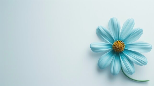 a blue flower with a yellow center on a light blue background with a yellow center on the center of the flower.