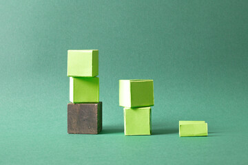 Ascending Stack of Green Cubes on a Soft Teal Background - Geometric Art