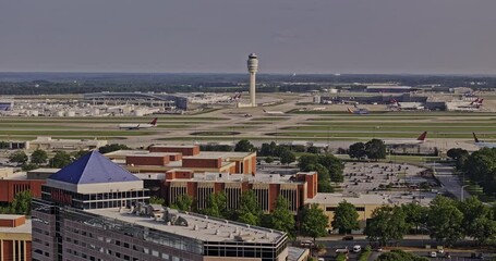 Atlanta Georgia Aerial v936 drone flyover Hapeville capturing International terminals at ATL Hartsfield airport with FAA air traffic control tower and Delta HQ - Shot with Mavic 3 Pro Cine - May 2023