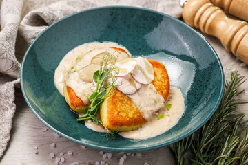 Potato pancakes with cream sauce and herbs, shepherd's pie