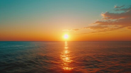 Fototapeta premium Beautiful sunset scene over the ocean, perfect for travel and nature concepts