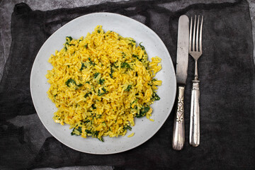 rice with egg and spinach on plate