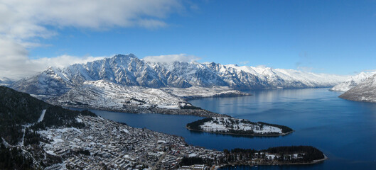 Aerial panoramic winter view of Queenstown, Lake Wakatipu and the Remarkables mountain range in the...
