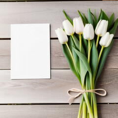 Blank white paper card mockup and elegant tulip bouquet . Spring greeting card