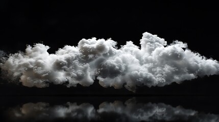 A large white cloud is floating in a black sky. The cloud is soft and fluffy, and it looks like it is made of cotton. - obrazy, fototapety, plakaty