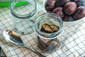 Plums dried in a dehydrator. Selective focus.