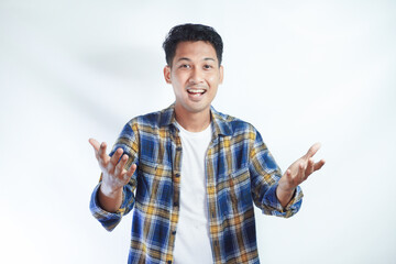 Fototapeta premium Adult Asian man smiling excited while open arms for greeting