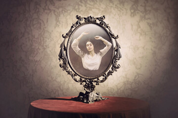 mirror with the reflection of a woman who is enraptured by her own beauty, concept of vanity - obrazy, fototapety, plakaty
