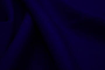 Texture of dark blue fabric closeup. Low key photo. Plexus threads. Clothing industry. Abstract...
