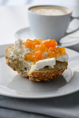 sandwich with cottage cheese and apricot jam; healthy breakfast, white background